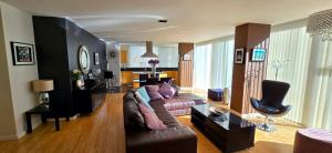 a living room with a couch and a table at Luxury Apartment Best location in Liverpool city center in Liverpool