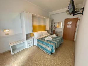 Postel nebo postele na pokoji v ubytování Hotel Crystal - SPIAGGIA INCLUSA con pacchetti personalizzati