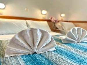 Postel nebo postele na pokoji v ubytování Hotel Crystal - SPIAGGIA INCLUSA con pacchetti personalizzati