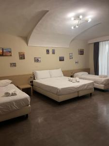 Postel nebo postele na pokoji v ubytování Adalesia Hotel & Coffee