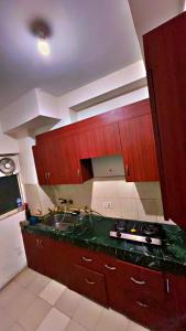 a kitchen with a sink and a counter top at Pure Haven 2BHK luxurious appartment in Noida