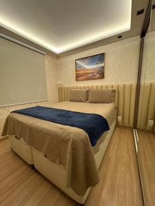 En eller flere senge i et værelse på Apartamento Aracaju