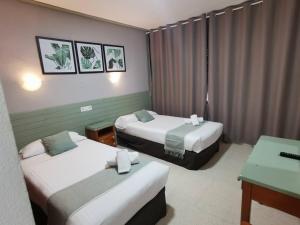 Postel nebo postele na pokoji v ubytování Hotel Costa Andaluza