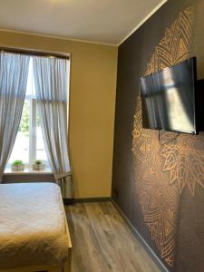 TV a/nebo společenská místnost v ubytování KVETa