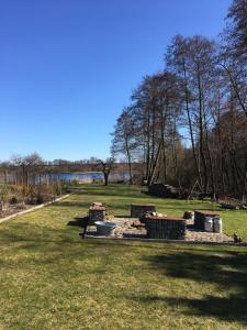 a park with a picnic table in the grass at Lakehouse in Brodowin in Chorin