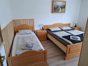 Postel nebo postele na pokoji v ubytování Hiša Bistrica