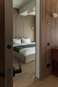 Postel nebo postele na pokoji v ubytování DOM hotel