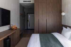 Postel nebo postele na pokoji v ubytování DOM hotel