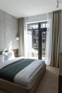 Postel nebo postele na pokoji v ubytování DOM hotel