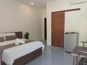 Postel nebo postele na pokoji v ubytování Lulinghayaw Resort-Panglao