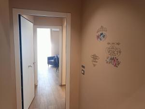 a hallway with a door leading to a room at Borgese Apartments in Palermo