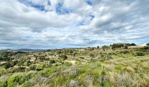 a view of a town on a hill with grass at Villa La Mansion in Benissa