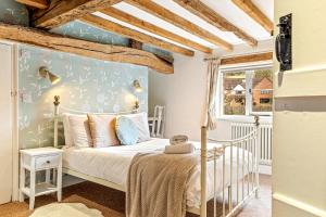 Voodi või voodid majutusasutuse Hunts cottage - Pet friendly toas