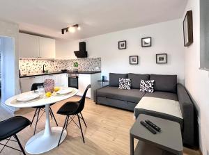 a living room with a couch and a table at Santa Lucia App in Oprtalj