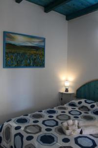 Postel nebo postele na pokoji v ubytování Sa Dommu de Kerciu vista mare IUN R0018