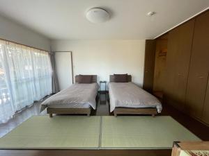 Postel nebo postele na pokoji v ubytování temple stay 玉林寺