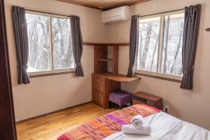 Postel nebo postele na pokoji v ubytování Panketo Lodge & Yoga Studio