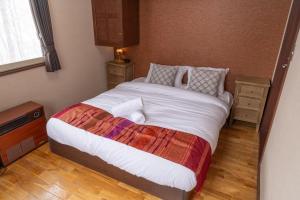 Postel nebo postele na pokoji v ubytování Panketo Lodge & Yoga Studio