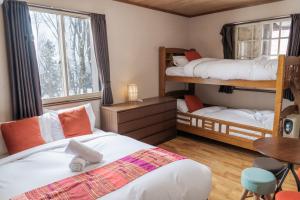 Postel nebo postele na pokoji v ubytování Panketo Lodge & Yoga Studio