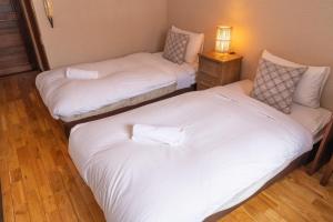 Postel nebo postele na pokoji v ubytování Panketo Lodge & Yoga Studio