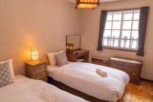 Postel nebo postele na pokoji v ubytování Panketo Lodge & Yoga Studio