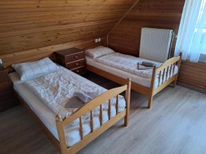 Postel nebo postele na pokoji v ubytování Hiša Bistrica