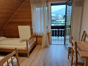 Postel nebo postele na pokoji v ubytování Hiša Bistrica