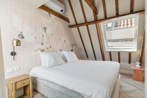 Giường trong phòng chung tại STONEBRIDGE boutique apartments - City centre