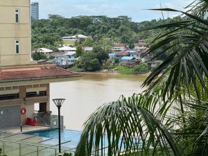 a view of a river from a building at 4 Pax - Scenic Riverfront Studio B, Kuching City in Kuching