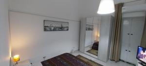 TV a/nebo společenská místnost v ubytování Casa Ramellini Guest House - Taranto Centro