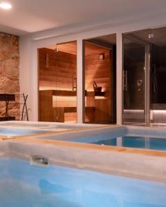 a swimming pool in a house at Inghirios Wellness Country Resort in Santa Maria la Palma