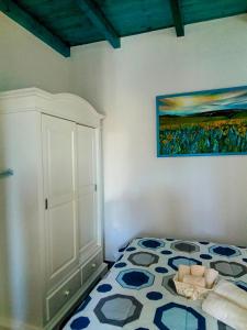 Postel nebo postele na pokoji v ubytování Sa Dommu de Kerciu vista mare IUN R0018