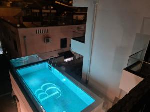 a swimming pool in the middle of a building at Datek's Apartments in Ulcinj