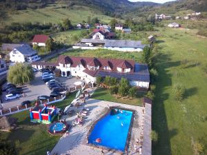 an aerial view of a resort with a swimming pool at Casa Tomșa in Rozavlea