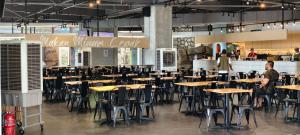 a group of tables and chairs in a restaurant at Supercozy kids-theme #4 Walk to i-City Park & Mall in Shah Alam