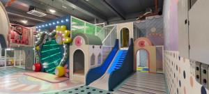 a childrens play room with a slide and a playground at Supercozy kids-theme #4 Walk to i-City Park & Mall in Shah Alam
