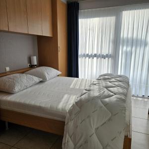 Postel nebo postele na pokoji v ubytování Sun & Sea Blutsyde