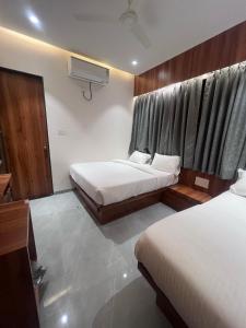 Postel nebo postele na pokoji v ubytování Hotel Rudraksh