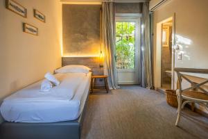 Letto o letti in una camera di Seven Boutique Hotel