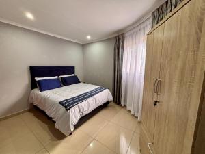 Ένα ή περισσότερα κρεβάτια σε δωμάτιο στο Pazuri Homestay