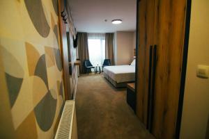 Ein Bett oder Betten in einem Zimmer der Unterkunft Hotel Via Serdika