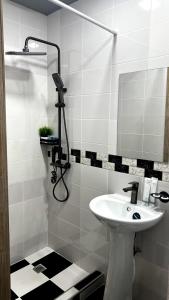 a bathroom with a sink and a mirror at Hayq Hotel in Yerevan