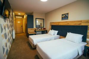 Ein Bett oder Betten in einem Zimmer der Unterkunft Hotel Via Serdika
