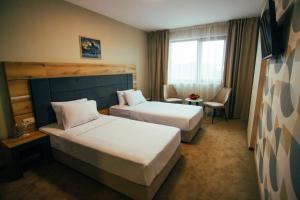 Ein Bett oder Betten in einem Zimmer der Unterkunft Hotel Via Serdika