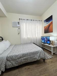 TV a/nebo společenská místnost v ubytování C homestay fullerton suites
