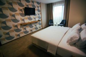 Ein Bett oder Betten in einem Zimmer der Unterkunft Hotel Via Serdika