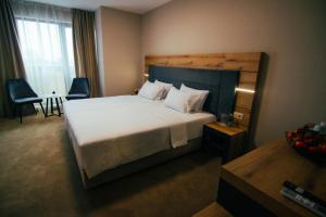 Ein Bett oder Betten in einem Zimmer der Unterkunft Hotel Via Serdika