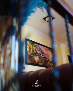 a flat screen tv on a wall in a room at HOTEL LYBETEN in Ferizaj +39 photos