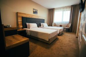 Ein Bett oder Betten in einem Zimmer der Unterkunft Hotel Via Serdika