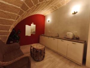 a kitchen with a sink and a counter in a room at Angolo del corso in Gallipoli